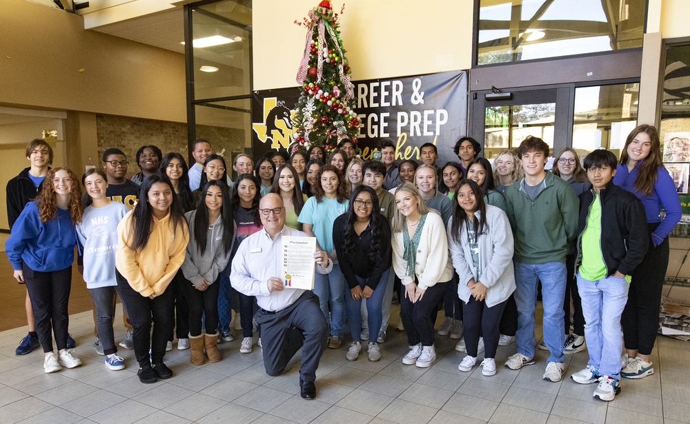 Nacogdoches Mayor Jimmy Mize shown with NHS students after reading proclamation