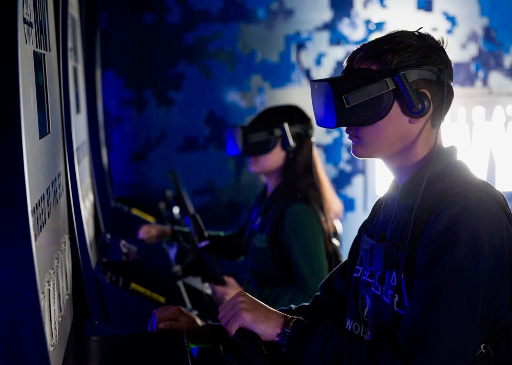 Two students wearing VR headsets
