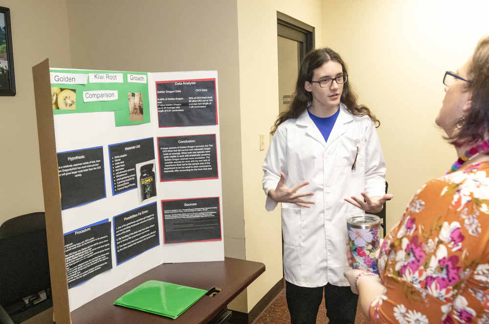 August Wright talks about his project during the STEM IV Science Fair